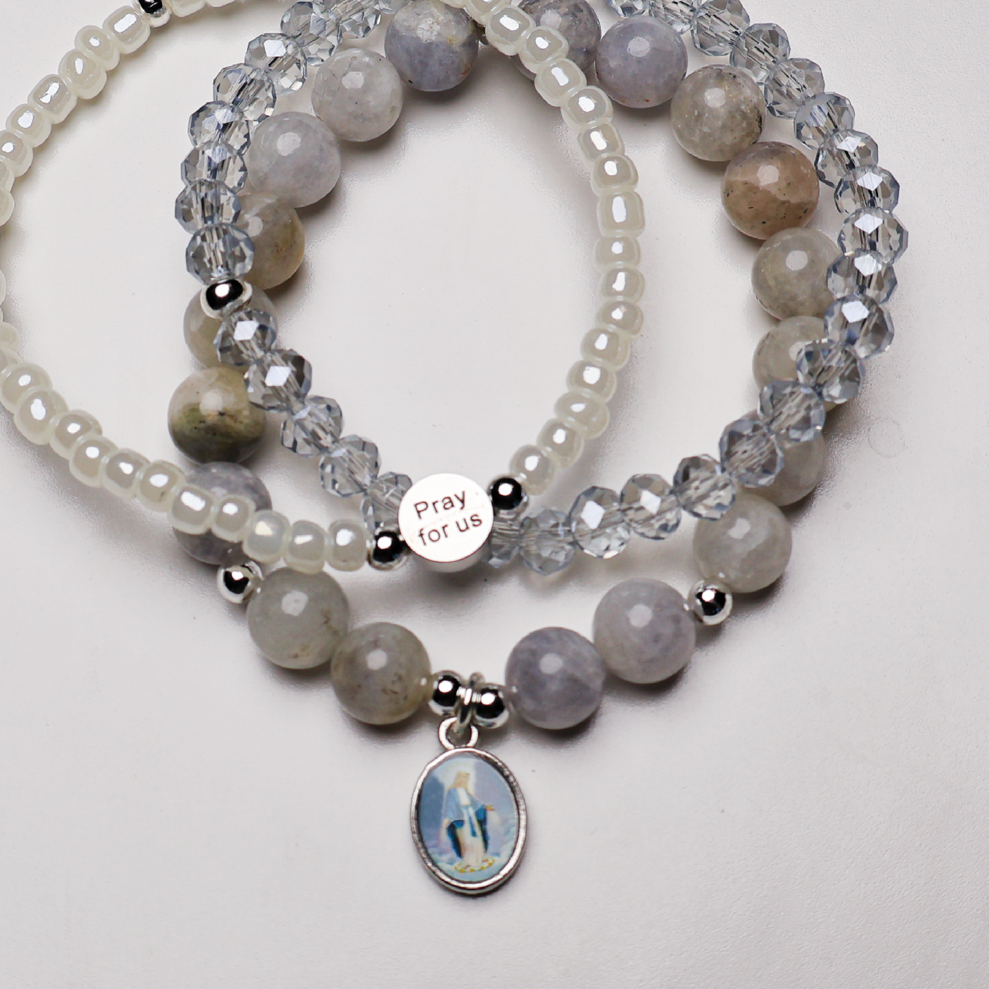 Set of beaded bracelets with a Blessed Virgin Mary medal and a "pray for us" bead.